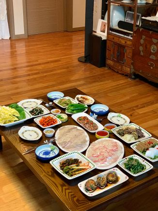 Home cooked is always the best - first meal prepared by my Mother In Law. Fresh Fish and Sashimi, Abalone, various types of kimchee and others