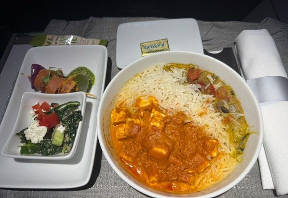 Paneer Makhani
jeera rice, spiced lentils with spinach and roasted peppers and onion.  It was about as good as an average frozen paneer meal one can buy at the grocery store.  I enjoyed it and always find Indian meals to be good on a plane since some of the spices/flavors break through my dulled senses at altitude.