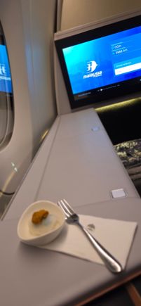 NRT-KUL: Welcome nibble, didn't taste very nice