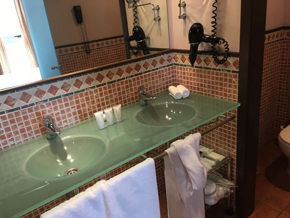Nice room. Double wash basins. King bed. Wooden floor.