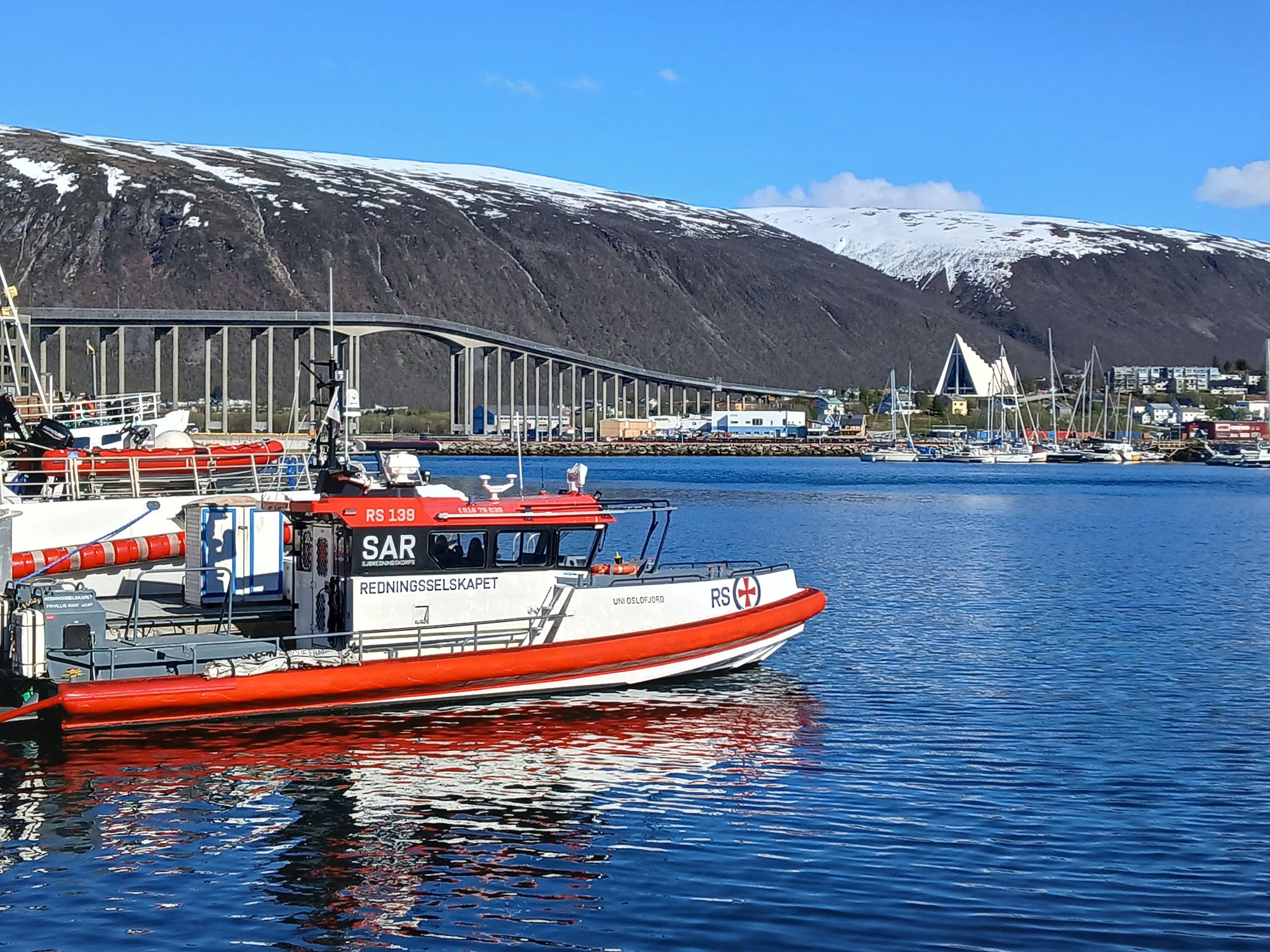 The old harbour, view of Arctic Cathedral across the bridge