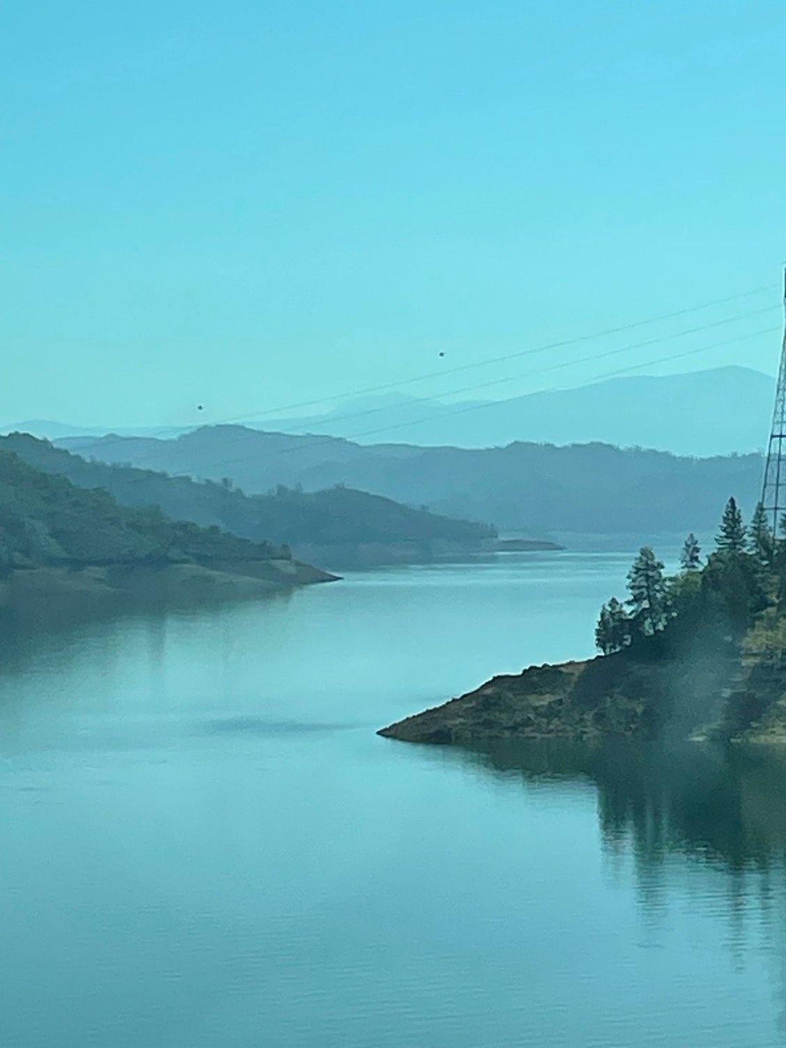 Layered views of Shasta Lake welcome you.