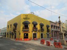 Breakfast at this upper floor cafe on outside balcony . Street construction everywhere.