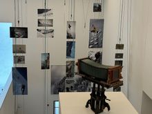 This set of photos mounted on ropes all covers images of rope-climbing teams.