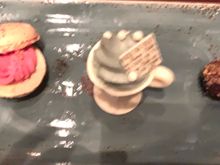 Desert trio. Raspberry macaron white chocolate cup filled with the grey stuff and a dark chocolate truffle