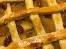 
This pie is made with pink lady apples, walnuts and golden raisins soaked in rum