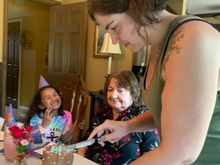 Whatever that cake was, it was delicious! From left to right, Michaela; the birthday sister; and Nicole, Nick’s sister and Michaela‘s mom.