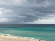 Taken yesterday. 30 seconds before I got out to the balcony with my phone, the water was really bright blue, but the sun started to go behind a cloud by the time I got there.