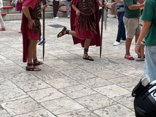 You will see a number of Roman guards around who will happily pose for pictures for a few euros.  There happened to be some young men with a soccer ball who were playing with the guards. If you look closely at the guard on the left you can see a soccer ball!
