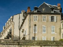River reflection of historic hotel where Croat SS recruits launched a heroic, but doomed, revolt against their SS masters in 1943.