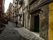 Typical local street. One sometimes had to hug the walls and become an artful dodger of passing vehicles, Those included scooters, bikes, cars, APEs and some customized ones that were unidentifiable. Some claim the population density to be the highest in Europe. *Other sources instead state that the population is 'the most dense of any isle in the Mediterranean'. 