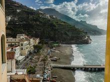 Our aforementioned rental had a big terrace. It can be seen to the far left in this shot, its black iron rail frame just visible in the distance, appearing as though jutting out from the top domed window. We were equidistant between Sal de Riso and his bro Alesandro's similar cafe, each about a 2 minute walk away. 