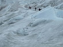 People trekking on the ice