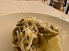 This artichoke was braised and stuffed with mojada, which I found very salty.  I inquired about the grated cheese served on top, which added more salt.  The server told me is was Parmesan but I am fairly sure that it was not..it was too white, and too salty.  Overall this was probably the least satisfying of many artichokes I had while in the area...