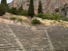 Looking up toward the ancient theatre, the largest structure of the Temple of Apollo. It housed a total of 5000 spectators. 

At the time we were there, work was being done on the steps leading up and beyond the theater. 
