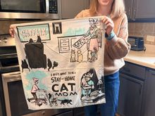 My daughter,  holding her favorite kitchen towel. 