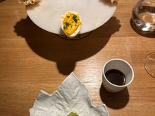 Dinner began with SIMPAR'S version of "brunch:" Waldorf salad, in foreground, in half a gem lettuce heart;  "egg Benedict--" the yolk is savory meringue and the yellow is......downright delicious!!  Tartelets of almond in a frothy consistency, and "coffee," which was an intense and lovely hot mushroom broth, which we were instructed to sip after every bite of food.