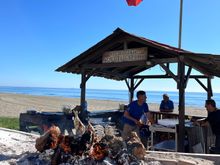 open charcoal fire on the "boat" where they grill the fish