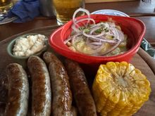 I loved my dish of sausages, potato salad and corn