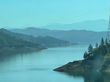 Layered views of Shasta Lake welcome you.