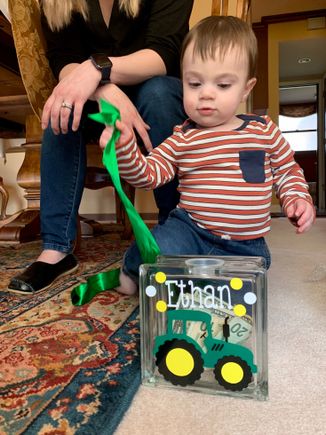 We got him a bank for his birthday along with a $20 bill, $10 bill, $5 bill and $1 dollar bill along with a quarter, dime, nickel, and penny to get him started.