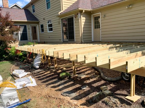 At the end of week one, the new deck is taking shape. The right third of the deck is going to be extended another 8 feet this week. They plan to lay the PVC decking this week, too.