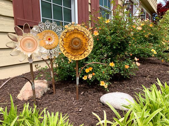 Joyce’s flower plates alongside our paprika roses.