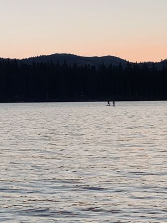 Nathan and Kate paddle boarding.
