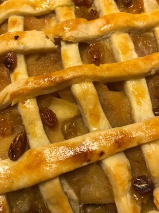 
This pie is made with pink lady apples, walnuts and golden raisins soaked in rum