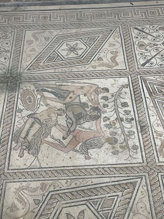 Oh..yeah...they also have an ancient mosaic, which is down this non-descript street, barely marked, but it does have a gate around it