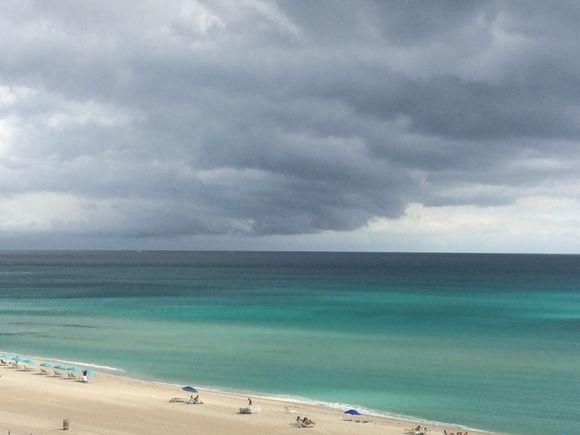 Taken yesterday. 30 seconds before I got out to the balcony with my phone, the water was really bright blue, but the sun started to go behind a cloud by the time I got there.