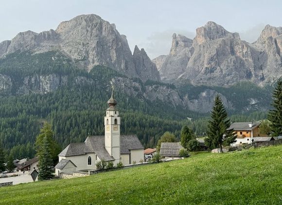 Iconic view of Colfosco, with the parish church of St. Vigilus in the foreground (locked when we tried to visit) and the Sella Massif behind it