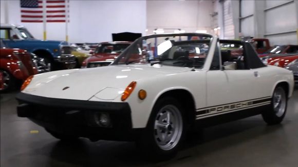 
Looked like this one, but with narrow striping in silver and black 