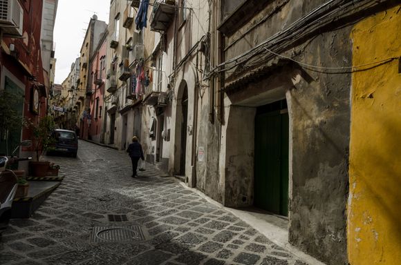 Typical local street. One sometimes had to hug the walls and become an artful dodger of passing vehicles, Those included scooters, bikes, cars, APEs and some customized ones that were unidentifiable. Some claim the population density to be the highest in Europe. *Other sources instead state that the population is 'the most dense of any isle in the Mediterranean'. 