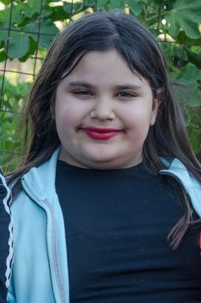We were near semi-rural via Soranzano. This girl was walking with mom plus their dog, which was a cross between a German shepherd and a mammoth.