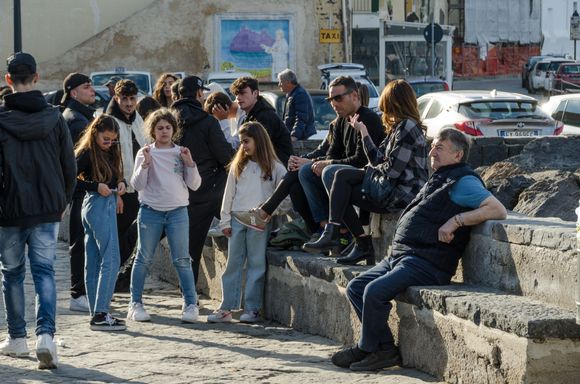 Returning back down and then across the bridge during the golden hour will guarantee visitors the chance to see local Ischiatani taking it easy. Just behind this crowd is the very modest local Museum del mare (of the sea).