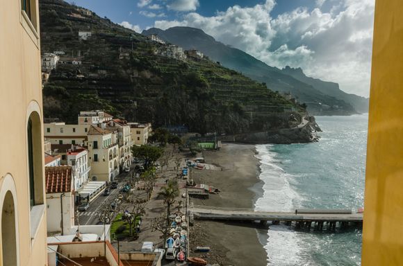 Our aforementioned rental had a big terrace. It can be seen to the far left in this shot, its black iron rail frame just visible in the distance, appearing as though jutting out from the top domed window. We were equidistant between Sal de Riso and his bro Alesandro's similar cafe, each about a 2 minute walk away. 