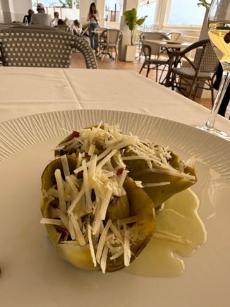 This artichoke was braised and stuffed with mojada, which I found very salty.  I inquired about the grated cheese served on top, which added more salt.  The server told me is was Parmesan but I am fairly sure that it was not..it was too white, and too salty.  Overall this was probably the least satisfying of many artichokes I had while in the area...