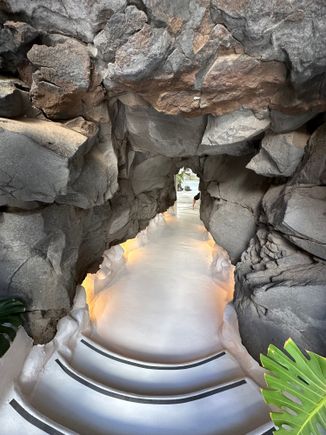Entrance to another hallway inside house.