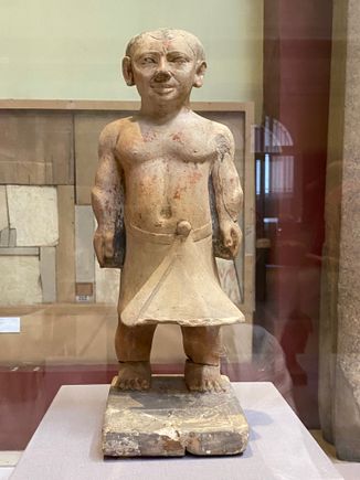 Statue of dwarf. in the old kingdom, people with dwarfism often held high social status
