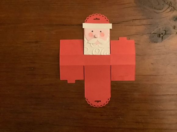 The little treat box is made from a die so very easy. Class got to emboss beard paper, cut a mustache from a heart, color face. It's just big enough to hold a box of tiic tacs ore a few small candies.