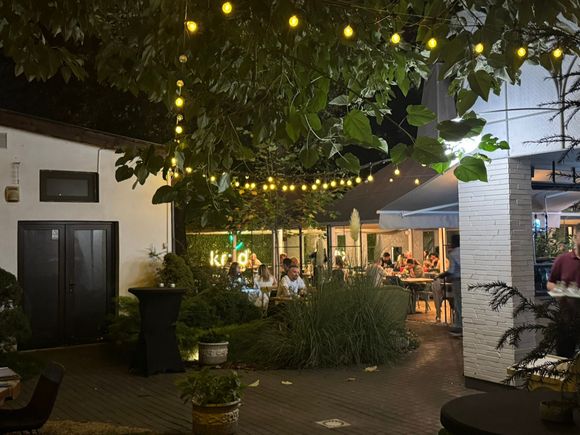 Dining on the patio at Krud Brasserie in Iasi, our first night in Romania