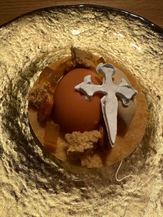 The penultimate course--a deconstructed tarta de Santiago. Even the white cross was edible!!   The "egg," cracked open to reveal a rich custard...this was almost too beautiful to eat, but demolish it we did....  There was one last course--a trio of chocolate "in homage to Ecuador," the native land of one of the two married  chefs; the grandfather of male chef Axel Smyth, came from Ireland, hence his non-Gallego surname.