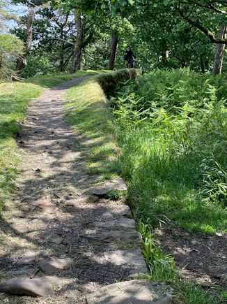 I'm actually walking on the wall. There is a little bit here to walk on.  People hike the entire wall and we saw a number of people with trekking bags.