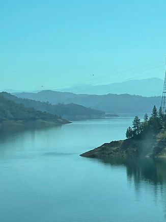 Layered views of Shasta Lake welcome you.