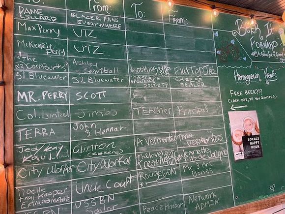 Beer it forward!  What a great idea. It may be hard to see but Mr. Perry gave a beer to Scott, Terra gave one to John and Hannah.  I'm guessing the people at the restaurant know who some of these people are.