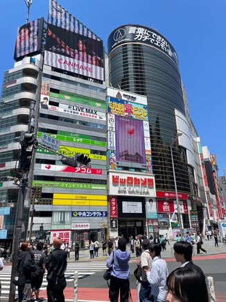 Some of the big buildings and so many signs and advertisements