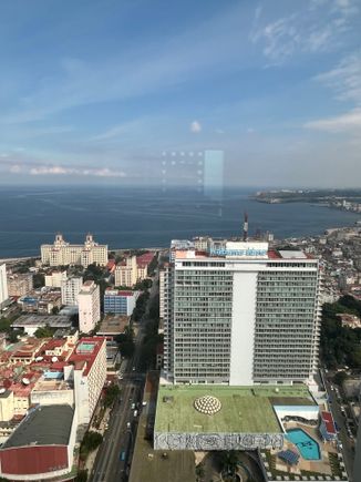 The malecon and National hotel in the background and the Habana Libre hotel in the foreground. 