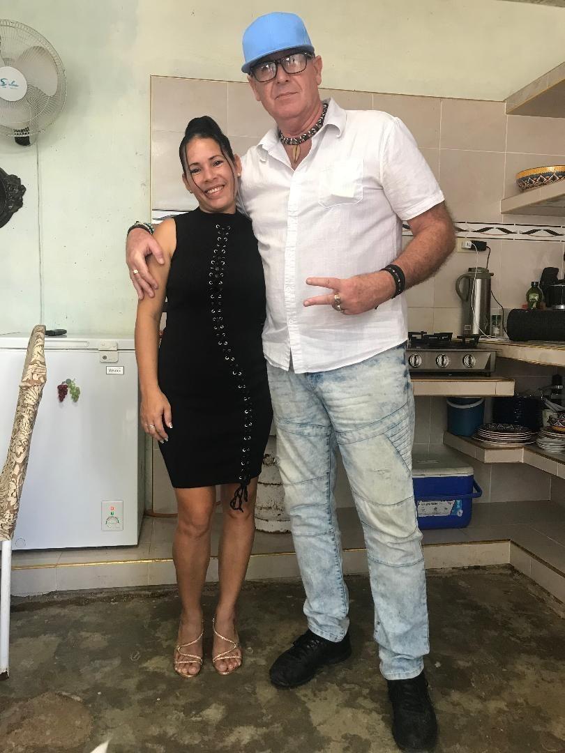 My wife and I in our casa kitchen dressed up to go out to Restaurante 1800 for a Christmas dinner with 3 other of our family members.
