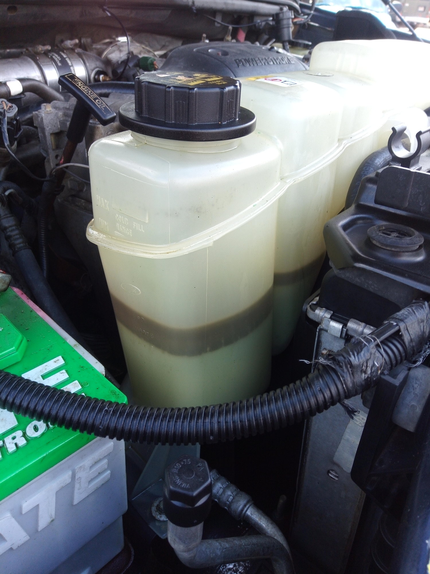 motor oil in coolant reservoir